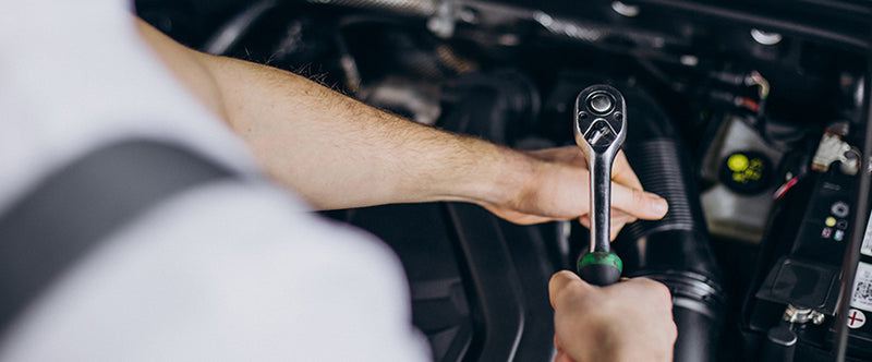 mechanic repairing car